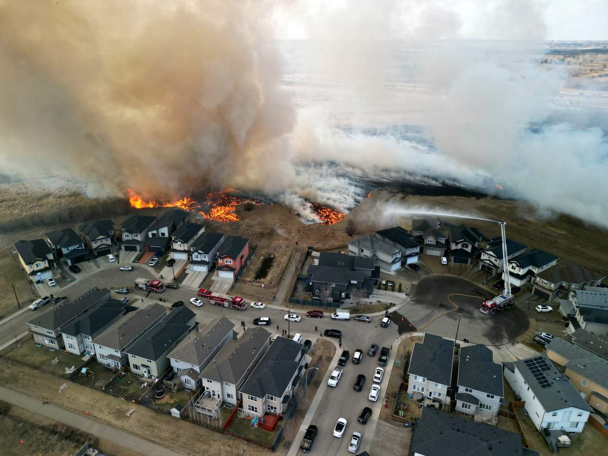 A grass fire near Edmonton's Albany neighbourhood, near Anthony Henday Drive and 127 Street, on Monday, April 24, 2023.