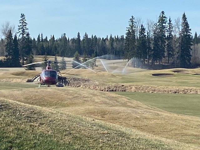 Parkland County fire crews going over their plan Monday, May 1, 2023, at Trestle Creek golf course where their command centre is.