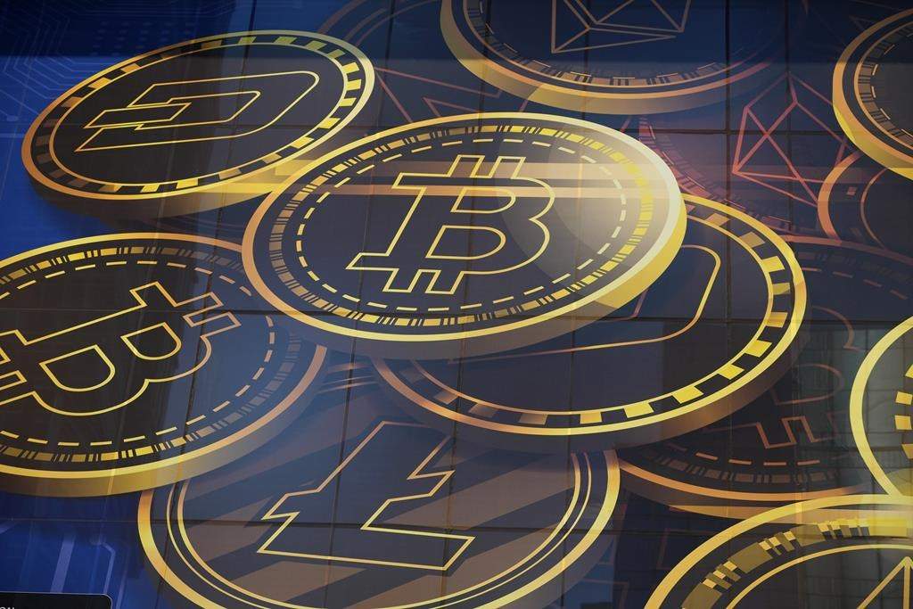An advertisement for bitcoin, one of the cryptocurrencies, is displayed on a building in Hong Kong, on Nov. 18, 2021.