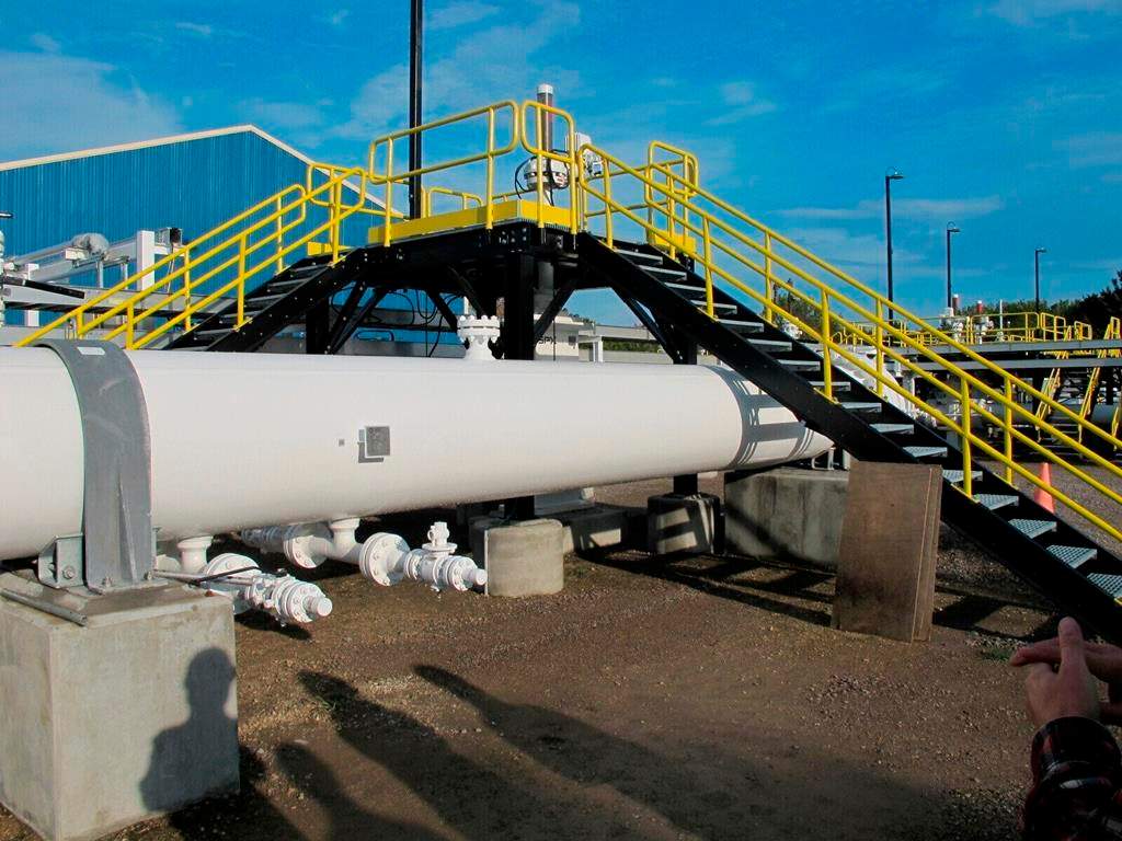 Enbridge Inc. says it has reached a deal with shippers for tolling on its Mainline pipeline system, which moves over three million barrels a day of crude oil and liquids from Western Canada. This photo taken in October 2016 shows an aboveground section of Enbridge's Line 5 at the Mackinaw City, Mich., pump station.