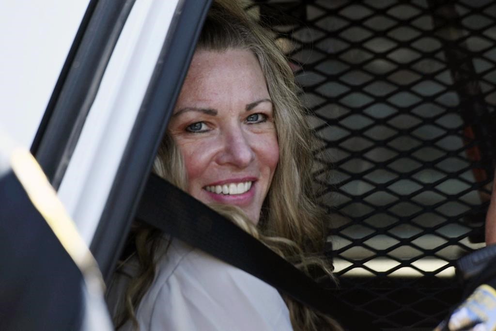 FILE - Lori Vallow Daybell sits in a police car after a hearing at the Fremont County Courthouse in St. Anthony, Idaho, on Aug. 16, 2022.