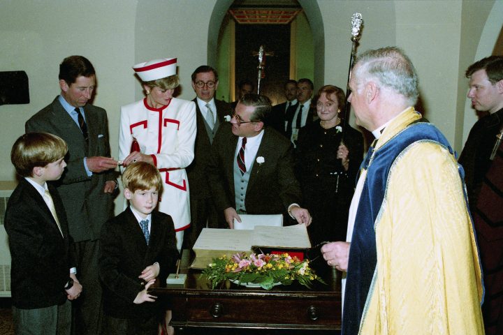 Their Royal Highnesses the Prince and Princess of Wales, Prince William and Prince Harry add their names to a Bible reserved for official visits at St. James Anglican Cathedral while attending Sunday service at the church during their visit to Toronto on Sunday, Oct. 27, 1991. From left are Prince William, Prince Charles, Prince Harry, Princess Diana, Edwin Hawken, warden, Andy Ritchie, sidesman, Barbara Hawkins, warden, The Very Rev. Duncan Abraham, dean and Paul Seddon, verger.