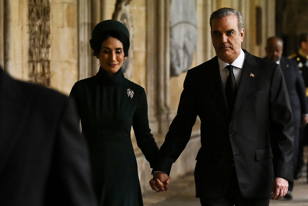 Dominican Republic President Luis Abinader (R) and his wife Raquel Arbaje arrive to take their seats ahead of the Coronation of King Charles III and Queen Camilla on May 6, 2023 in London, England.