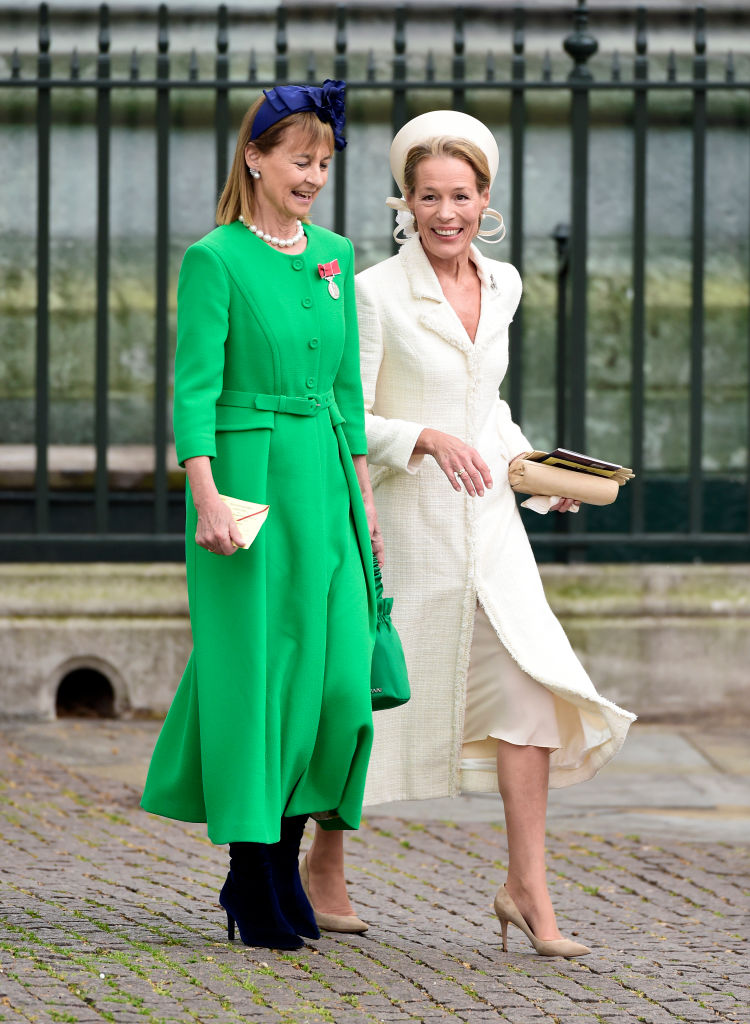 Guests laughing as they arrive in Parliament Square ahead of the Coronation of King Charles III and Queen Camilla on May 06, 2023 in London, England.