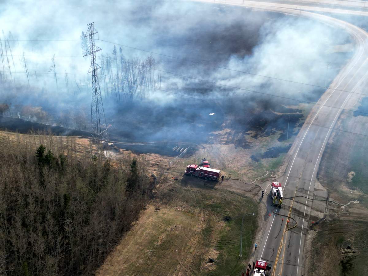 A large grass fire near 111 Avenue and Anthony Henday Drive in west Edmonton on Monday, May 1, 2023.