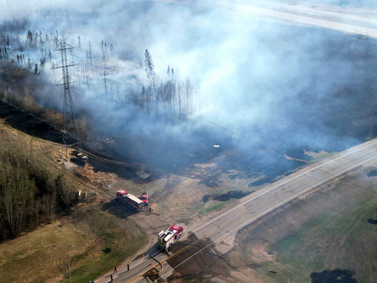 A large grass fire near 111 Avenue and Anthony Henday Drive in west Edmonton on Monday, May 1, 2023.