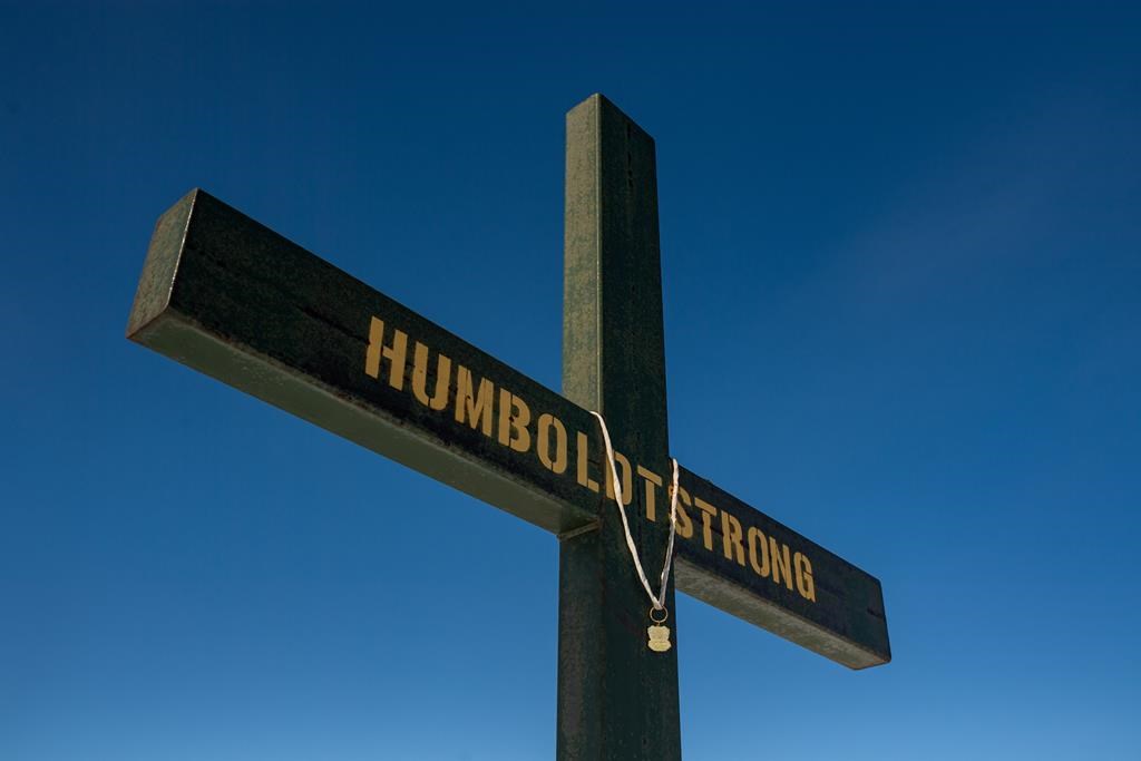 Police and community leaders in western Manitoba are looking to Saskatchewan for advice following a fatal collision that has drawn comparisons to the deadly Humboldt Broncos bus crash. A memorial on the roadside where the Humboldt Broncos bus crash took place is shown on Highway 35 near Armley, Sask., Saturday, March 18, 2023. 