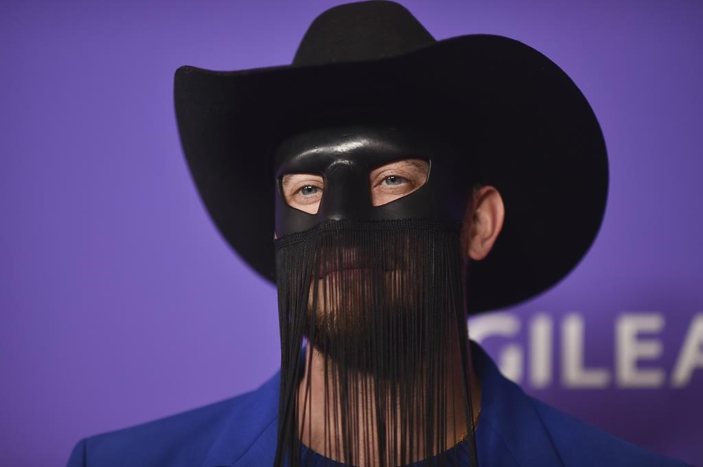 Country star Orville Peck postpones shows due to mental and physical health issues.