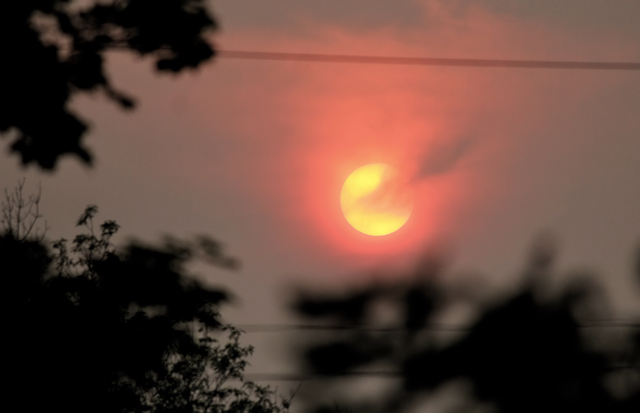 The sun breaks through smoke just north of Peterborough, Ont. An air quality statement remains in effect for the region.