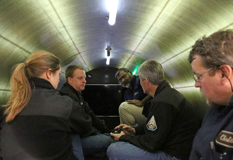 A view inside the Titan, with crew members from a previous expedition.