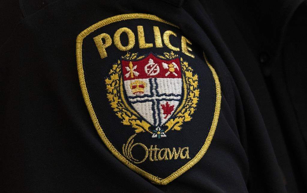 A close-up of an Ottawa Police officer’s badge is seen, in Ottawa, Thursday, April 28, 2022. Ottawa Police Service (OPS) says more than 20 people overdosed over the weekend. THE CANADIAN PRESS/Adrian Wyld.