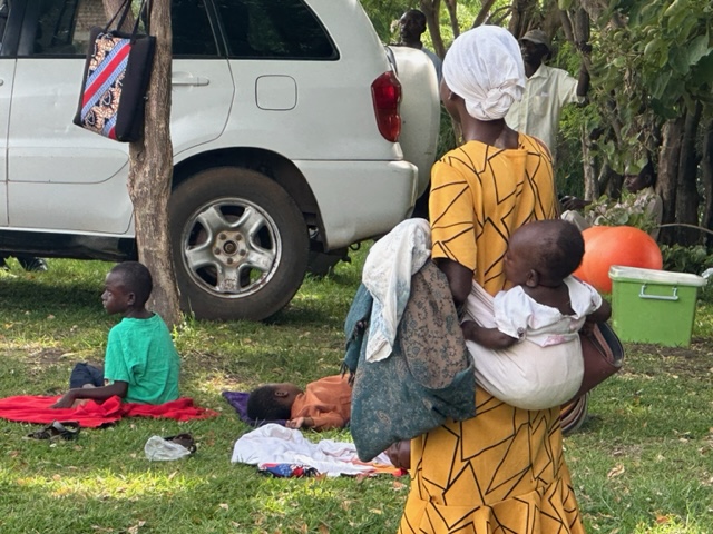 A Ugandan mother carried her visually impaired daughter for nearly an hour over steep terrain to attend an outreach clinic partially funded by Embrace.