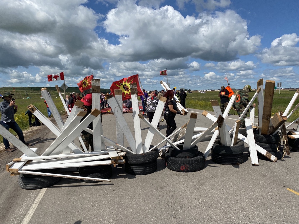 Landfill protest.
Protestors setting up road block.