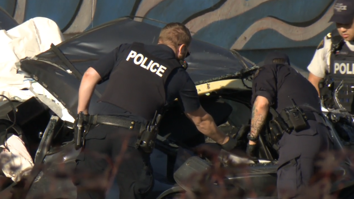 Police investigate the wreckage of a fatal crash in Burnaby on Wed. July 19, 2023.