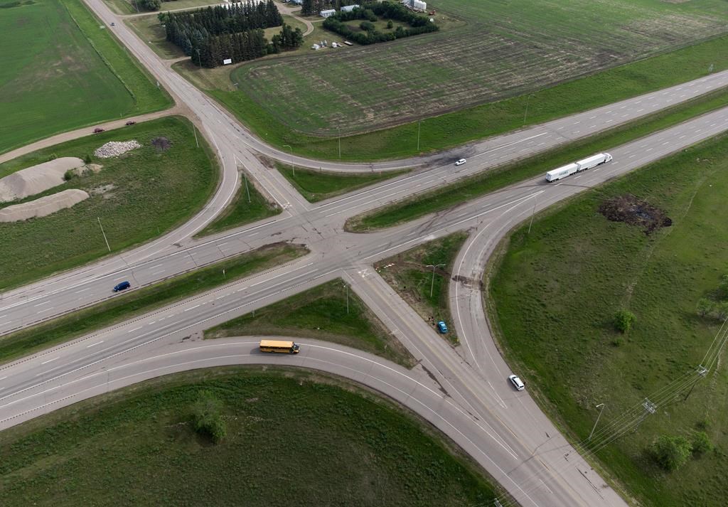 A scorched patch of ground where a bus carrying seniors ended up after colliding with a transport truck and burning is seen on the edge of the Trans-Canada Highway where it intersects with Highway 5, west of Winnipeg near Carberry, Man., Friday, June 16, 2023.