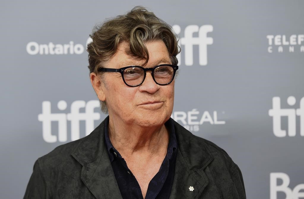 Robbie Robertson attends a press conference for "Once Were Brothers: Robbie Robertson and The Band" on day one of the Toronto International Film Festival on Thursday, Sept. 5, 2019, in Toronto. Robertson, the lead guitarist and songwriter for The Band, whose classics include “The Weight,” “Up on Cripple Creek” and “The Night They Drove Old Dixie Down,” died at 80, according to a statement from his manager.