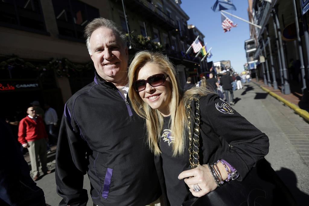 Sean and Leigh Anne Tuohy stand on a street in New Orleans, Feb. 1, 2013.