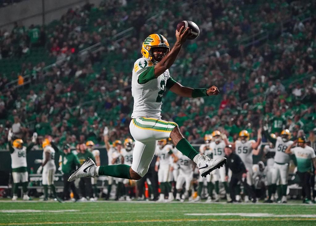 Edmonton Elks quarterback Tre Ford (2) scores a touchdown against the Saskatchewan Roughriders during the second half of CFL football action in Regina, on Friday, September 15, 2023. 