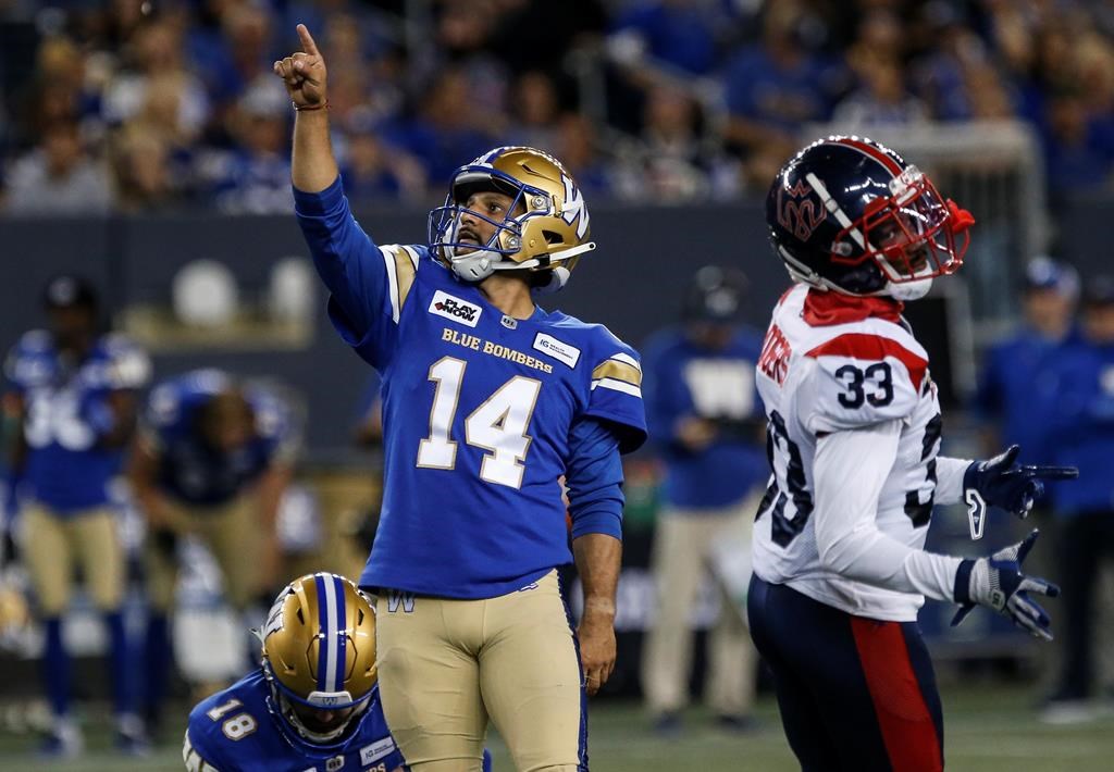 Blue Bombers placekicker Sergio Castillo is used to having football players run full blast at him while he concentrates on kicking balls. Castillo (14) makes the conversion kick against the Montreal Alouettes during second-half CFL action in Winnipeg on Aug. 24, 2023.