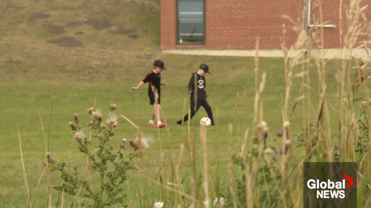 Easton Beatch and Bennett Love playing soccer.