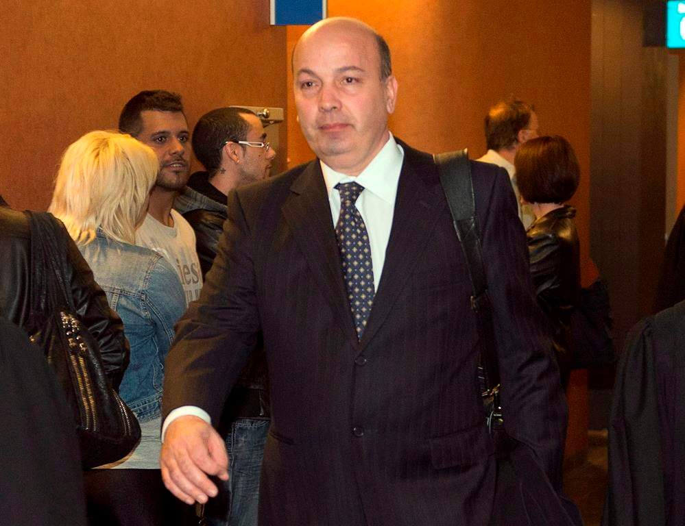 Quebec's Court of Appeal has ordered the former chair of Montreal city council's executive committee to stand trial on corruption charges. Frank Zampino, former chairman of the city of Montreal executive committee, leaves the courtroom after a brief appearance to set a trial date on fraud charges, in Montreal, Monday, April 29, 2013. 