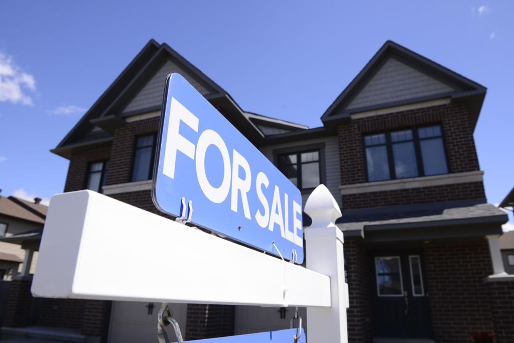 A new home is displayed for sale in a housing development in Ottawa on Tuesday, July 14, 2020.