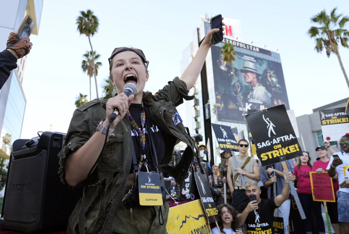 SAG-AFTRA captain Mary M. Flynn with a microphone.