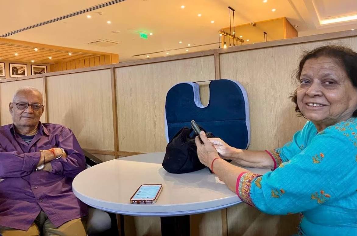 Harish Pant with family member Saroj Pande at Indira Gandhi International Airport in Delhi before a flight to Montreal on Sept. 10.