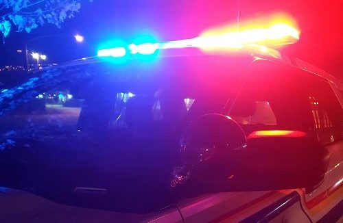 A police vehicle with its lights on.
