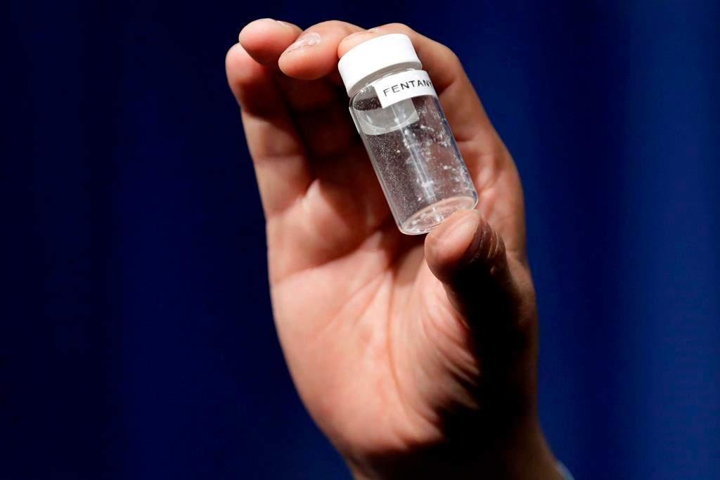 A reporter holds up an example of the Fentanyl.