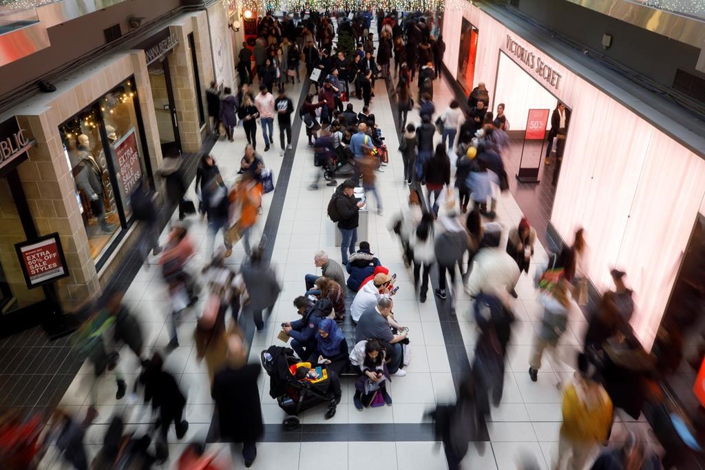 Shoppers are seen at Toronto Eaton Centre during Boxing Day in Toronto, Thursday, Dec. 26, 2019. 