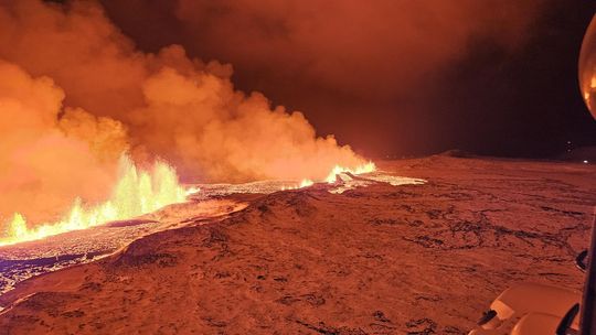 The eruption of a volcano on the Reykjanes peninsula of south-west Iceland is viewed in this webcam image.