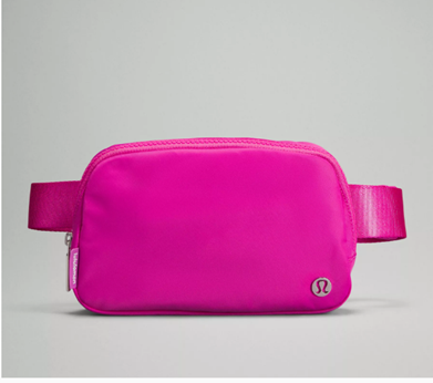 A Lululemon belt bag in pink.
