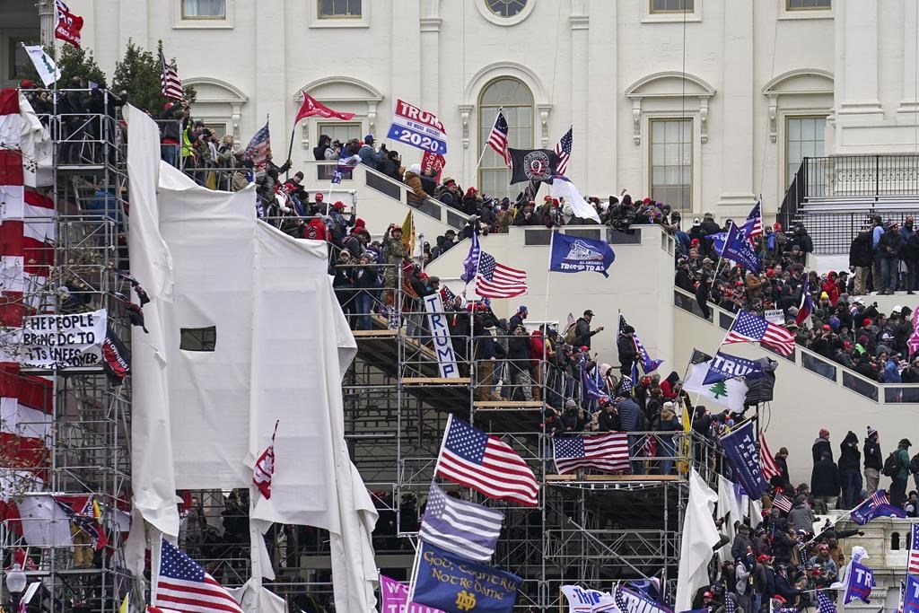In this Jan. 6, 2021 file photo insurrectionists loyal to President Donald Trump riot outside the Capitol in Washington.