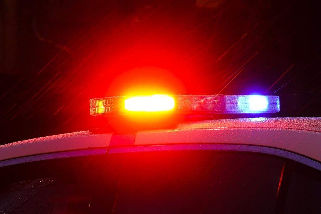 A police car with flashing lights is shown in Philadelphia, Monday, Jan. 17, 2022.