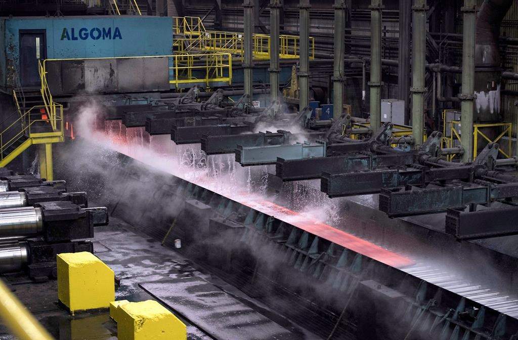 Algoma Steel Group Inc. says a structure supporting utilities piping at its coke-making plant collapsed on Saturday. Steam rises as water is poured over hot steel at Essar Steel Algoma in Sault Ste. Marie, Ont., Wednesday, March 14, 2018. THE CANADIAN PRESS/Justin Tang.