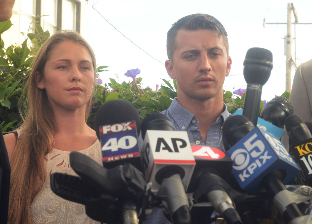 Denise Huskins and Aaron Quinn stand in silence during a press conference on July 13, 2015.