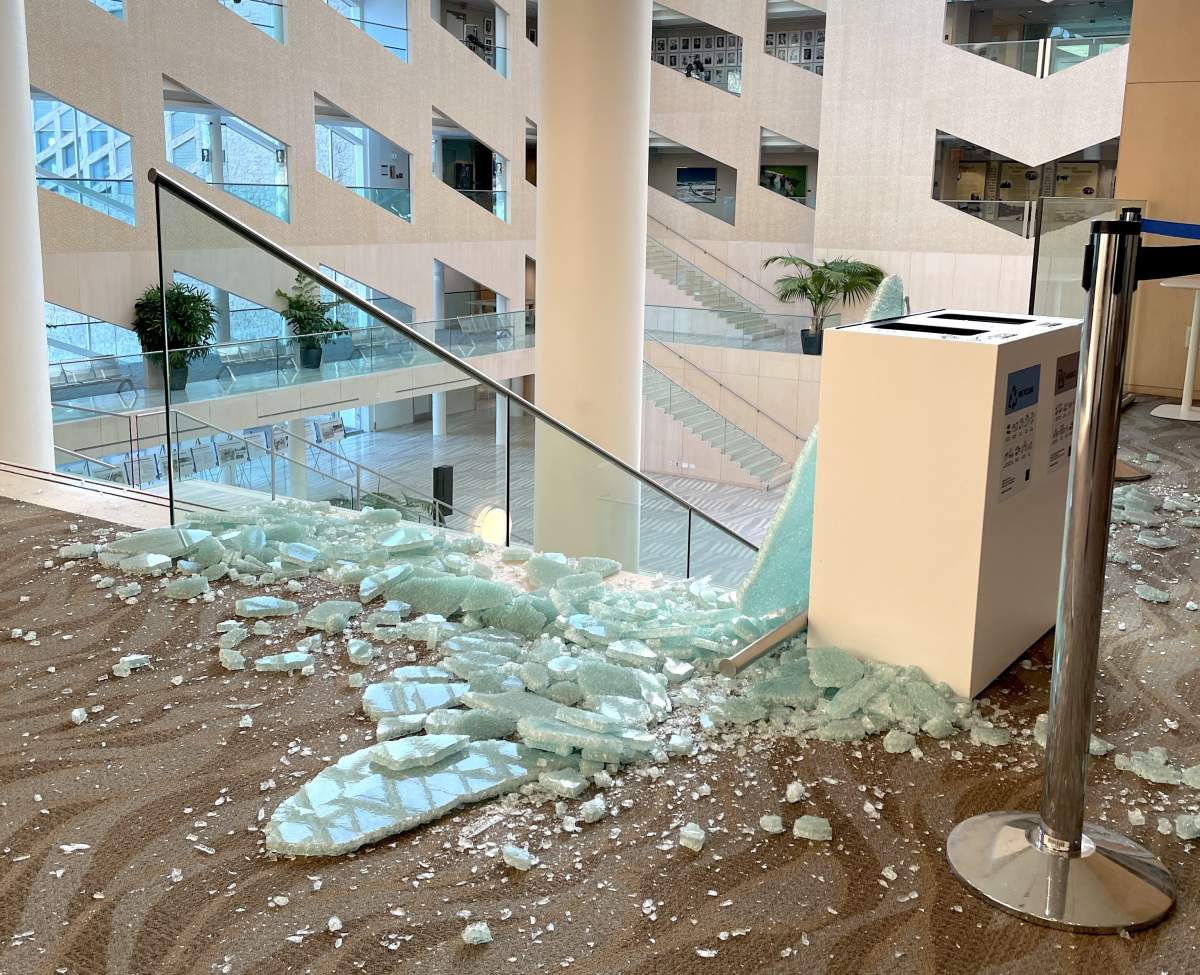 A broken panel of glass at Edmonton City Hall Wednesday, Jan. 24, 2024.