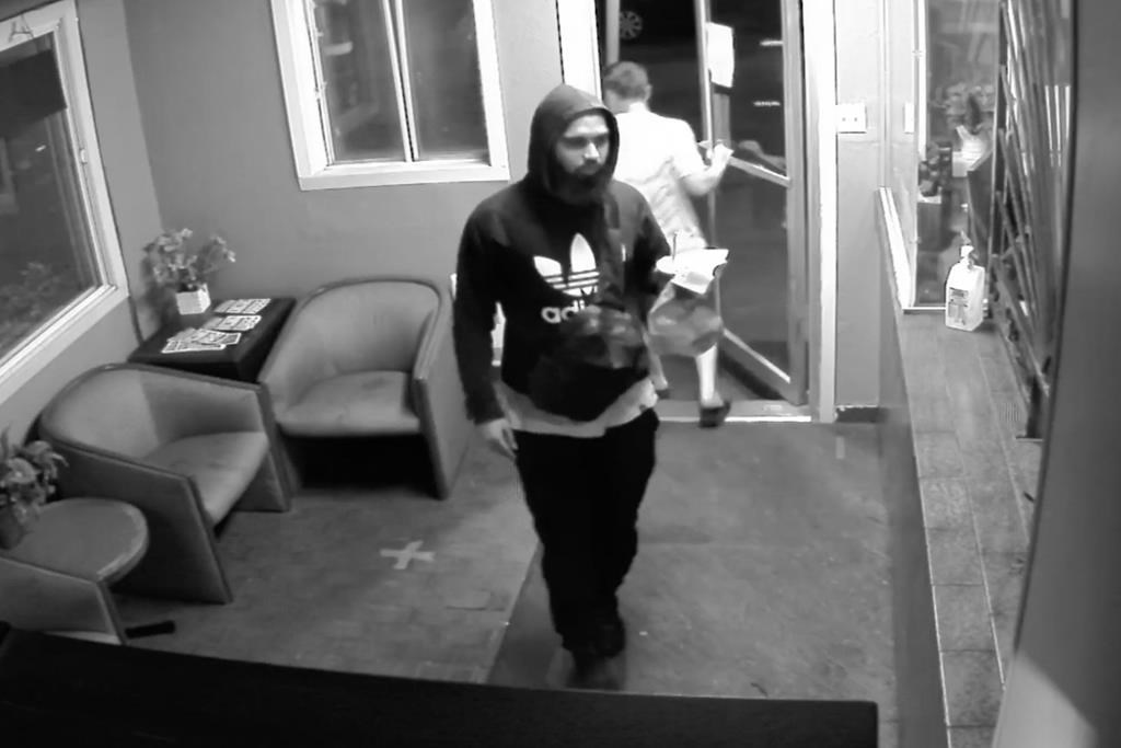 Abdulla Shaikh is seen in a capture taken from surveillance video at a Montreal motel submitted into evidence at a coroner's inquiry being heard in Montreal. A Quebec coroner has issued a final report into the violent deaths of three people who were killed at random in the Montreal area in 2022 by a mentally ill man, recommending the province create a specialized court to deal with mental health cases.