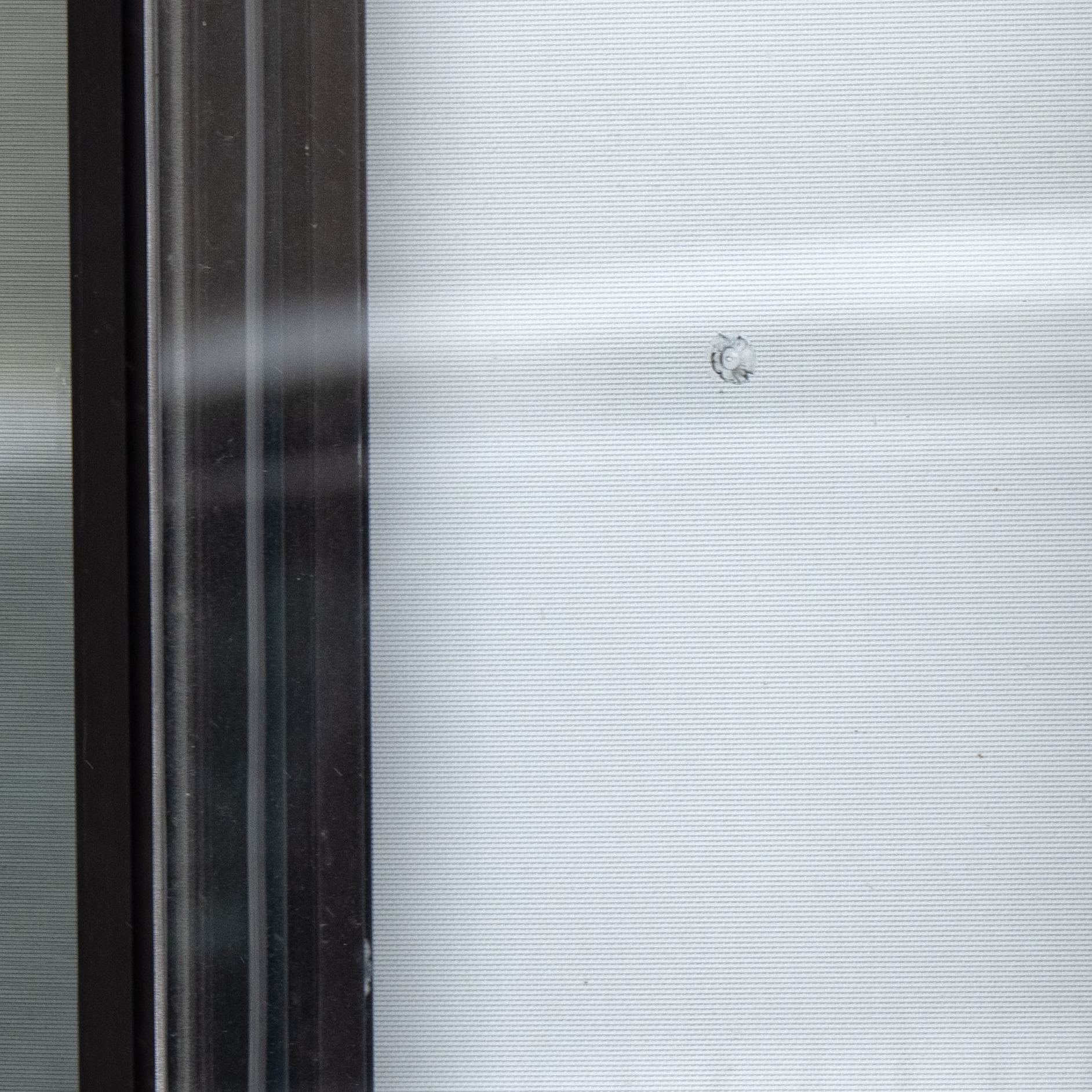 Bullet hole in window at Talmud Tora school after shots were fired at two Jewish schools in Montreal on Nov. 9, 2023. THE CANADIAN PRESS/Ryan Remiorz