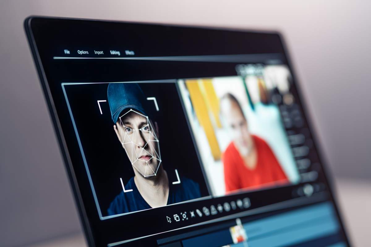 Photo illustration of an AI-generated face being used in a video call.