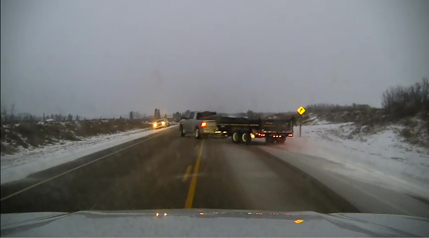 Dashcam image of a stolen truck and trailer evading Alberta RCMP near Saddle Lake Cree Nation on Feb. 8, 2024.