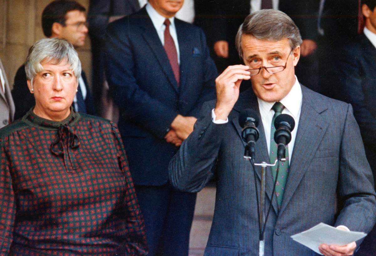 Prime Minister Brian Mulroney, along with Trade Minister Pat Carney, makes a statement after a day of briefing the provincial premiers on the state of the North American trade talks in this Sept. 14, 1987 file photo in Ottawa.