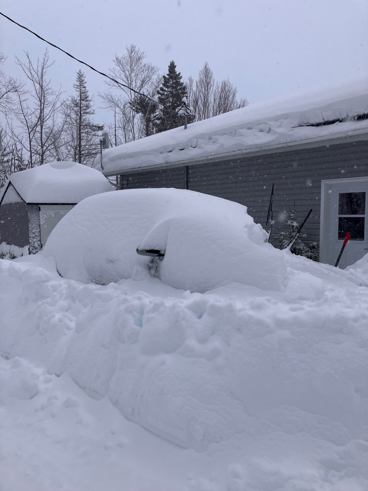 This picture sent in by a viewer shows a car buried in snow.