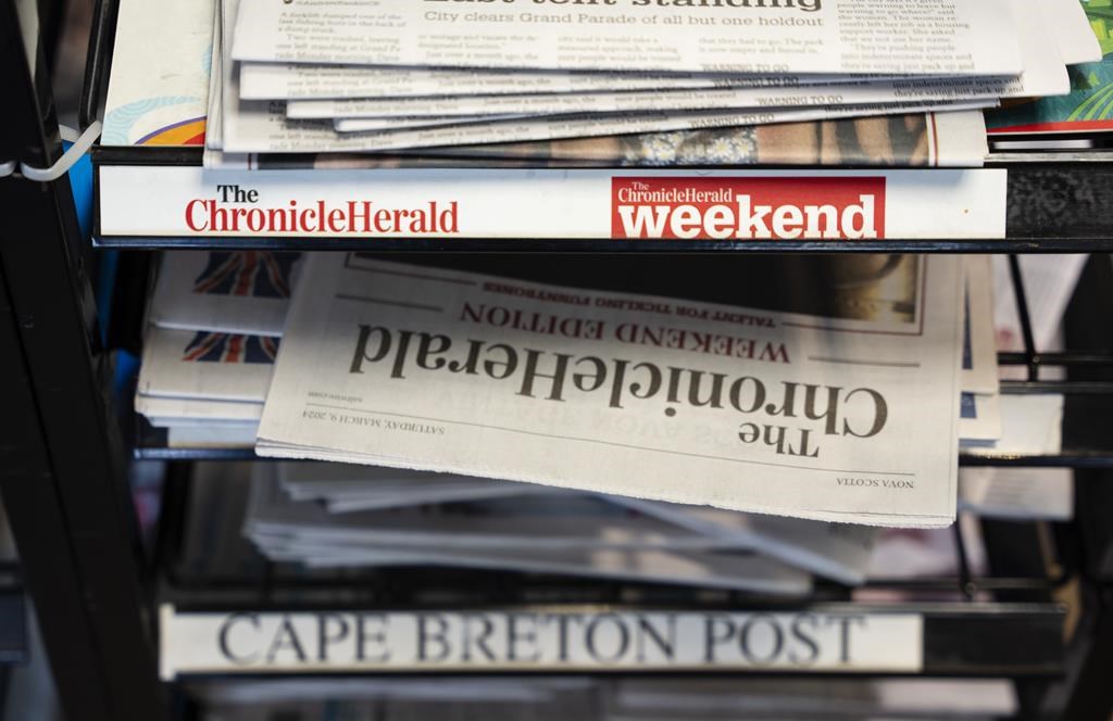 Newspapers owned by SaltWire Network Inc. are photographed in Halifax on Tuesday, March 12, 2024. A media expert says the decision by Atlantic Canada's largest newspaper company to seek protection from its creditors is another sign of the accelerating decline of the newspaper business. THE CANADIAN PRESS/Darren Calabrese.