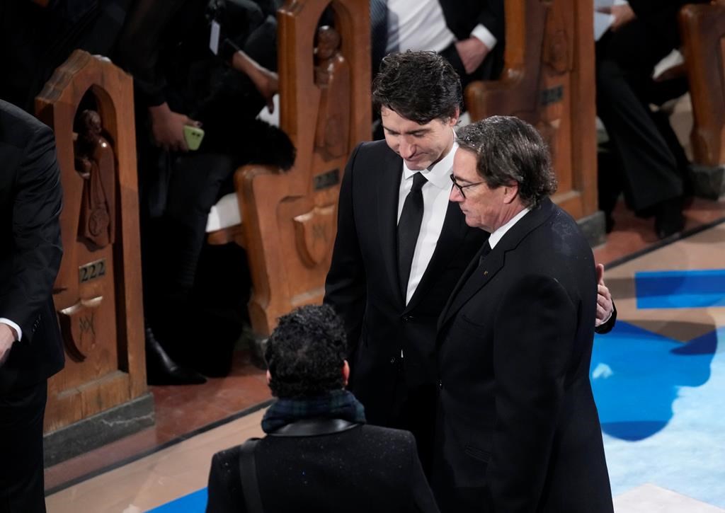 Prime minister Justin Trudeau and Canadian businessman Pierre Karl Péladeau arrive at the funeral of former prime minister Brian Mulroney, in Montreal, Saturday, March 23, 2024.