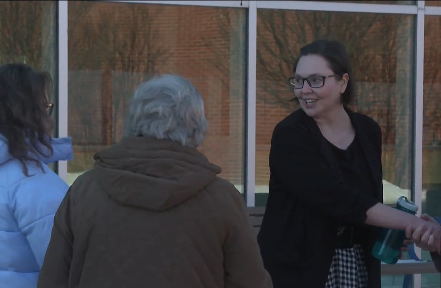 Medicine Hat Mayor Linnsie Clark shakes hands with supporters following an announcement saying she will be pursuing legal action following council voting to strip her of her powers of mayor.