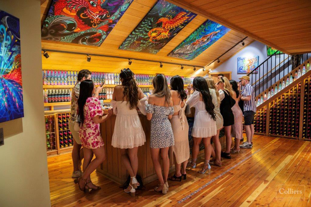 A group tasting wine at Vibrant Vines Winery.