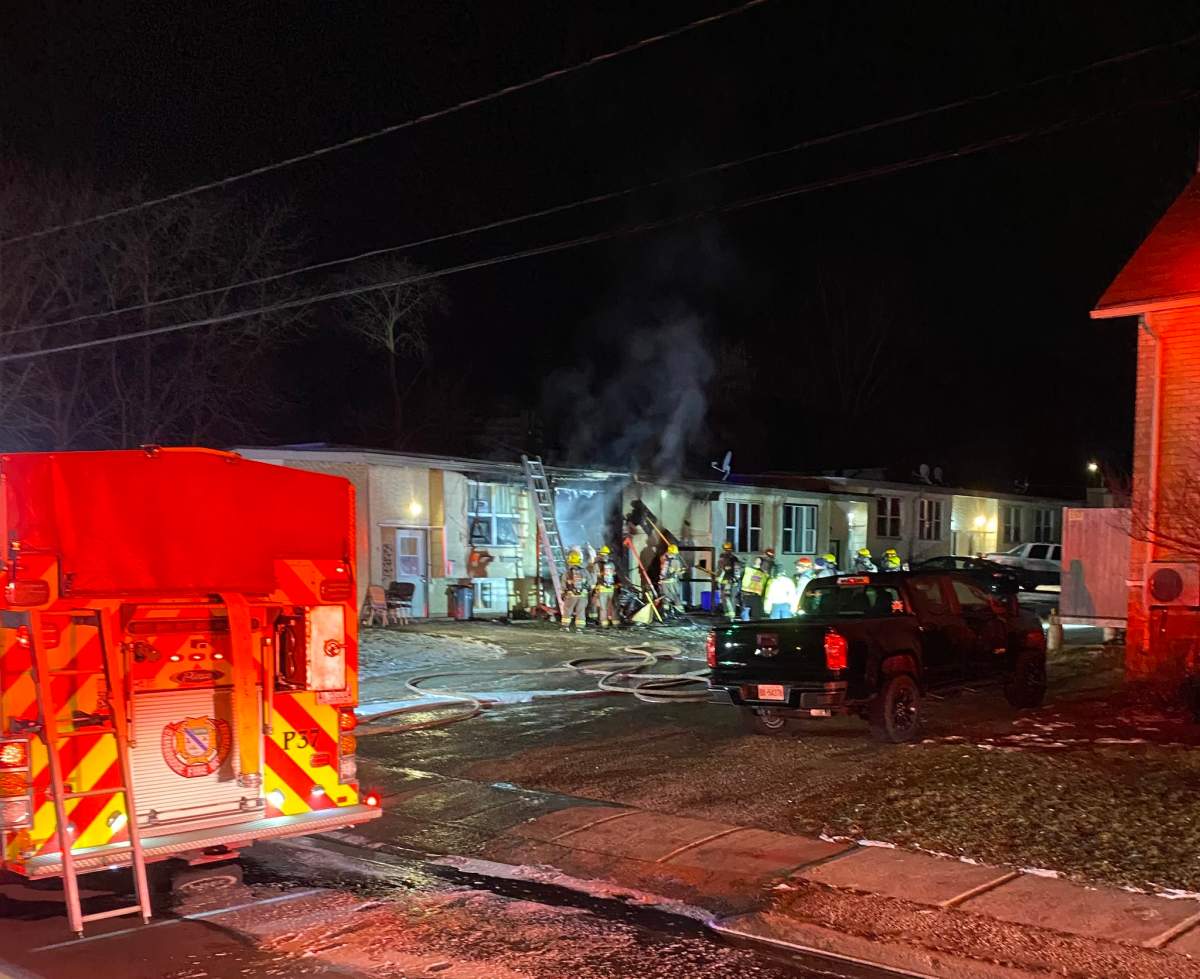 There were no physical injuries reported to police as a result of the fire but there was 'extensive damage' to one of the homes in the complex in Cambridge.