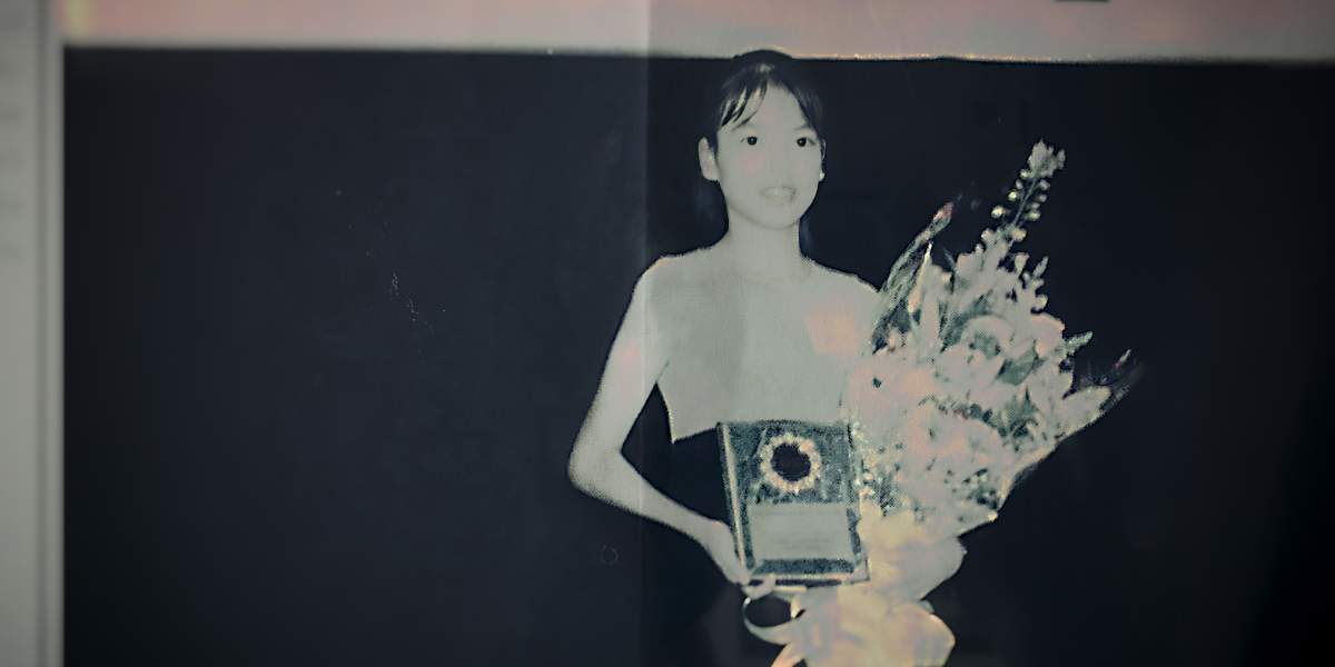 Jennifer Pan poses with an award and flowers in an undated image.